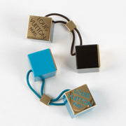 Shop this authentic Louis Vuitton Set of 2 Hair Cubes Pre-Loved on Labellov.com