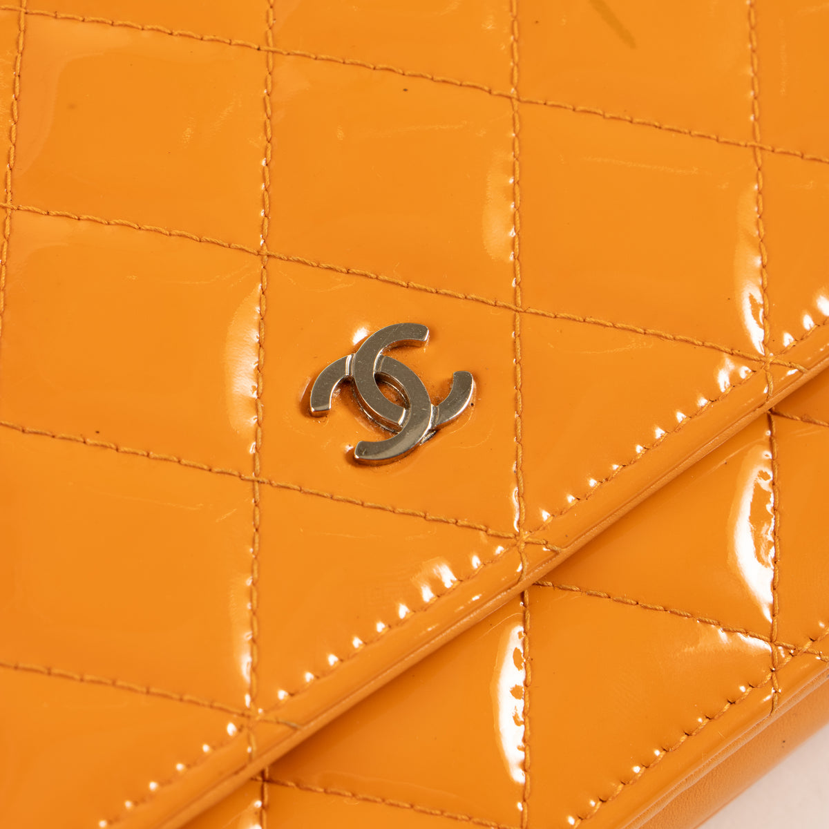 Shop this authentic Chanel Orange Patent Leather Classic Wallet On Chain Pre-Loved on Labellov.com