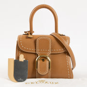 Shop this authentic luxury Delvaux Vegetal Rodeo Calf Brillant Mini Surpiqué Bag Pre-Loved on Labellov.com