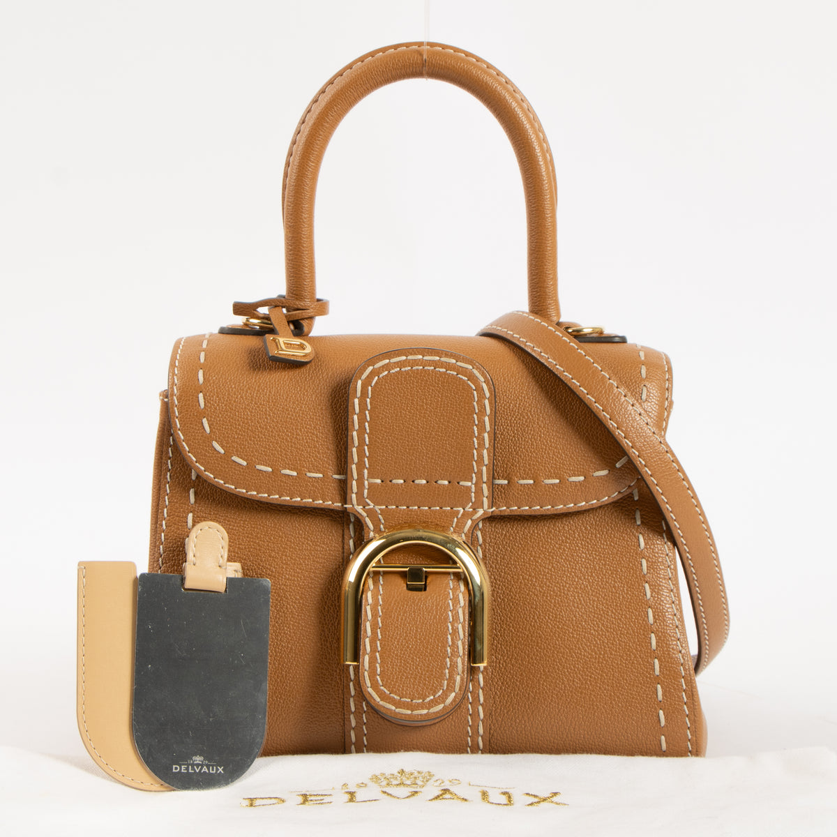 Shop this authentic luxury Delvaux Vegetal Rodeo Calf Brillant Mini Surpiqué Bag Pre-Loved on Labellov.com
