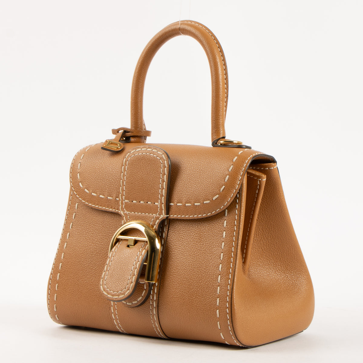 Shop this authentic luxury Delvaux Vegetal Rodeo Calf Brillant Mini Surpiqué Bag Pre-Loved on Labellov.com