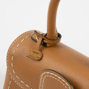 Shop this authentic luxury Delvaux Vegetal Rodeo Calf Brillant Mini Surpiqué Bag Pre-Loved on Labellov.com