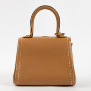 Shop this authentic luxury Delvaux Vegetal Rodeo Calf Brillant Mini Surpiqué Bag Pre-Loved on Labellov.com
