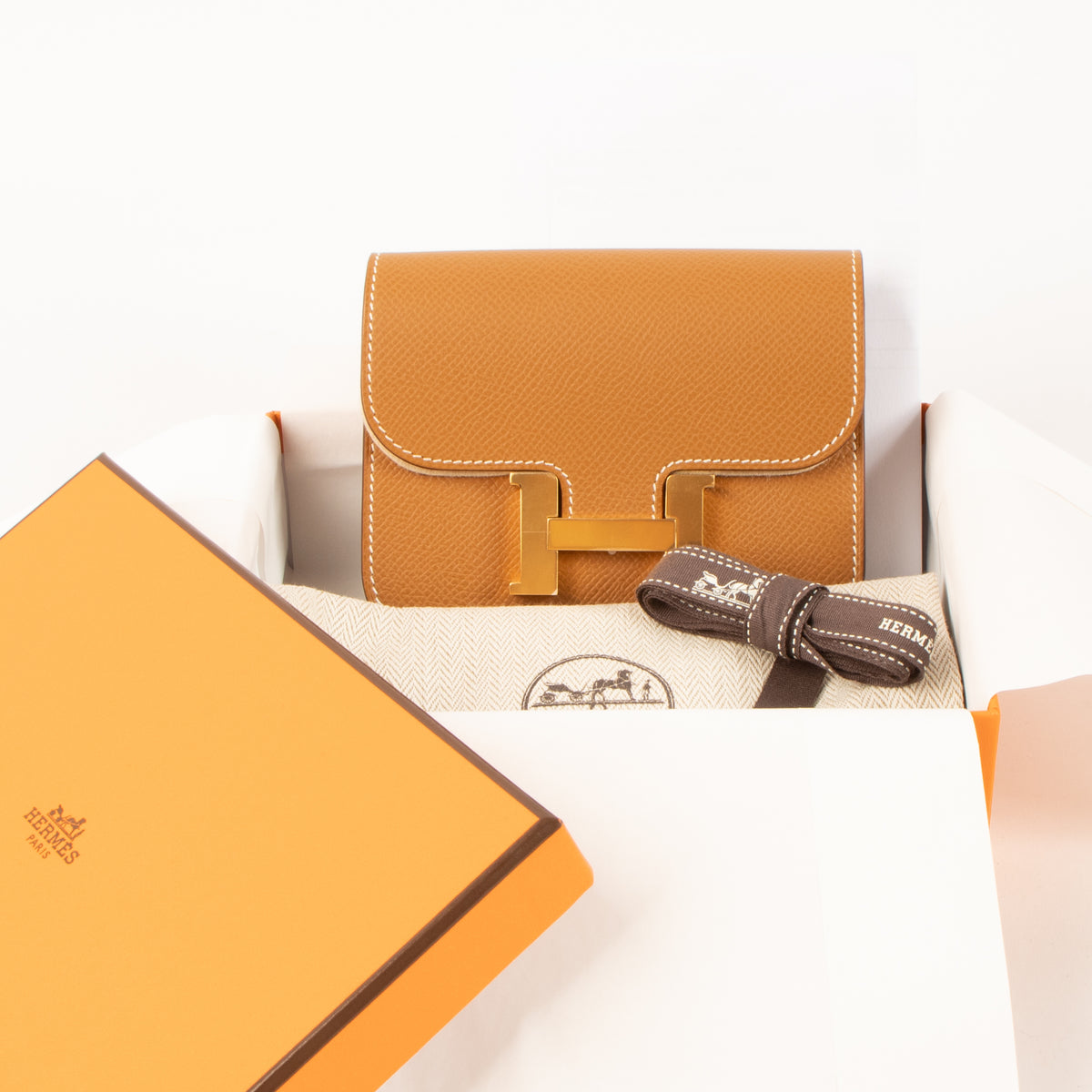 Shop this authentic Hermes Constance Slim Wallet Gold Evercolor GHW Pre-Loved on Labellov.com