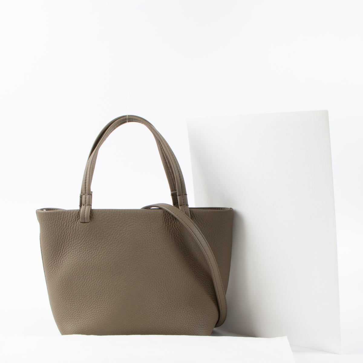 Shop this authentic The Row Taupe Calfskin Parker Small Tote Bag pre-loved on Labellov.com