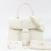 Shop this authentic Delvaux Ivory Box Calf Brillant GM Bag pre-loved on Labellov.com