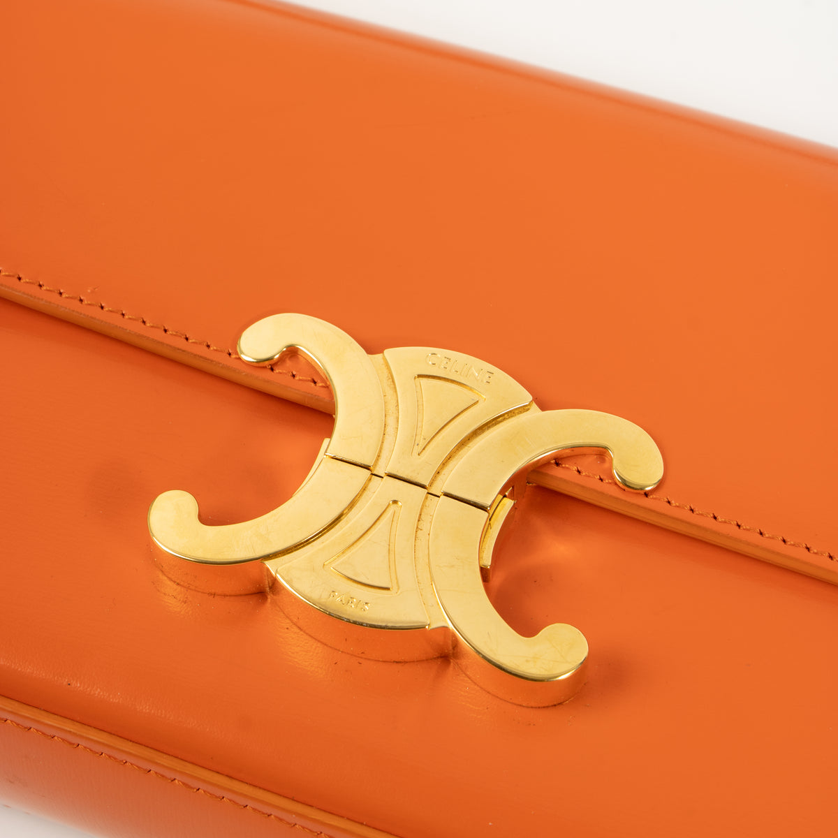 Shop this authentic Celine Orange Shiny Calfskin Claude Shoulder Bag pre-loved on Labellov.com