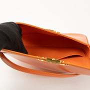 Shop this authentic Celine Orange Shiny Calfskin Claude Shoulder Bag pre-loved on Labellov.com