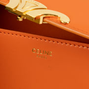 Shop this authentic Celine Orange Shiny Calfskin Claude Shoulder Bag pre-loved on Labellov.com