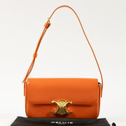 Shop this authentic Celine Orange Shiny Calfskin Claude Shoulder Bag pre-loved on Labellov.com