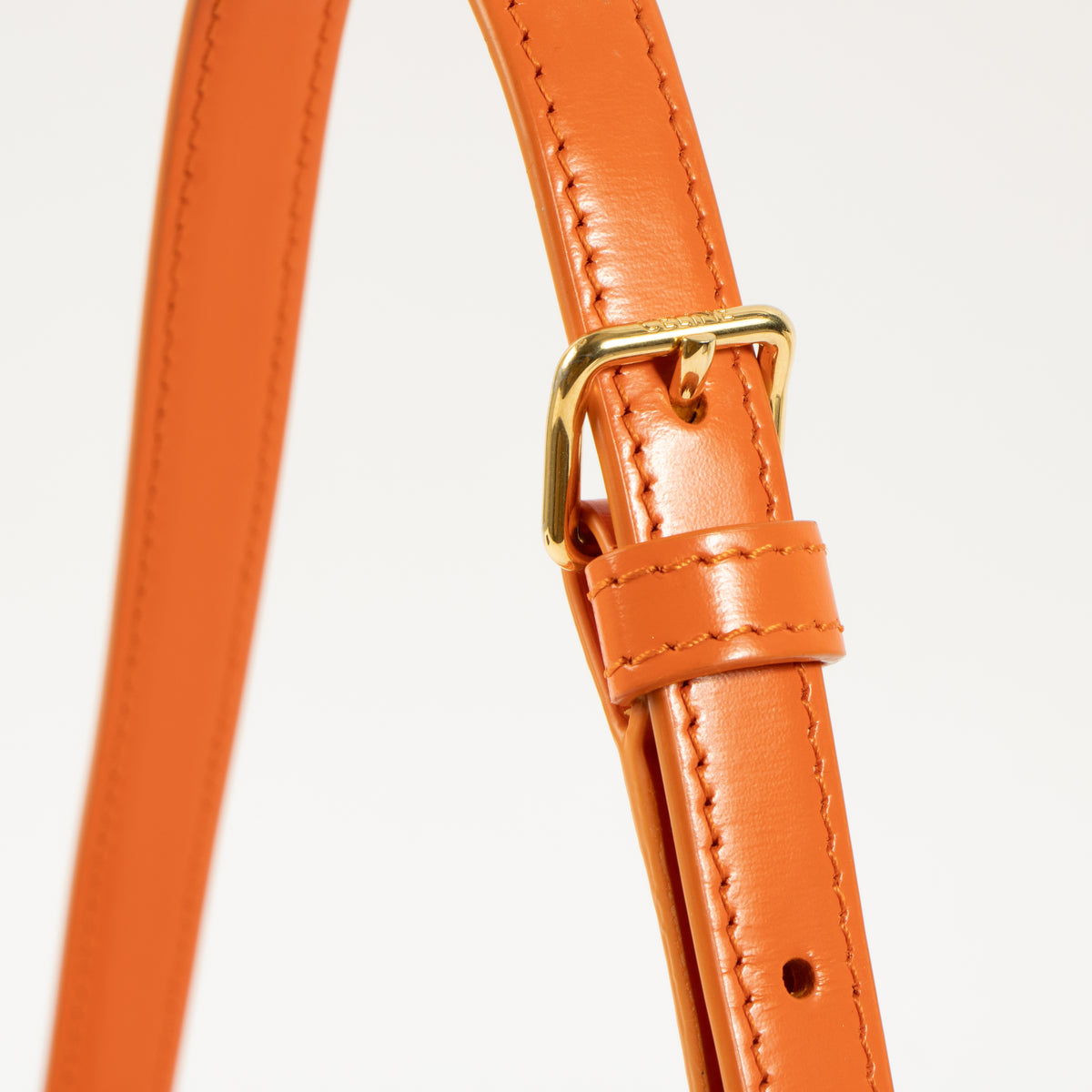 Shop this authentic Celine Orange Shiny Calfskin Claude Shoulder Bag pre-loved on Labellov.com