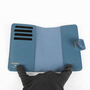 Shop this 100% authentic Chanel Blue Denim Passport Holder at Labellov.com