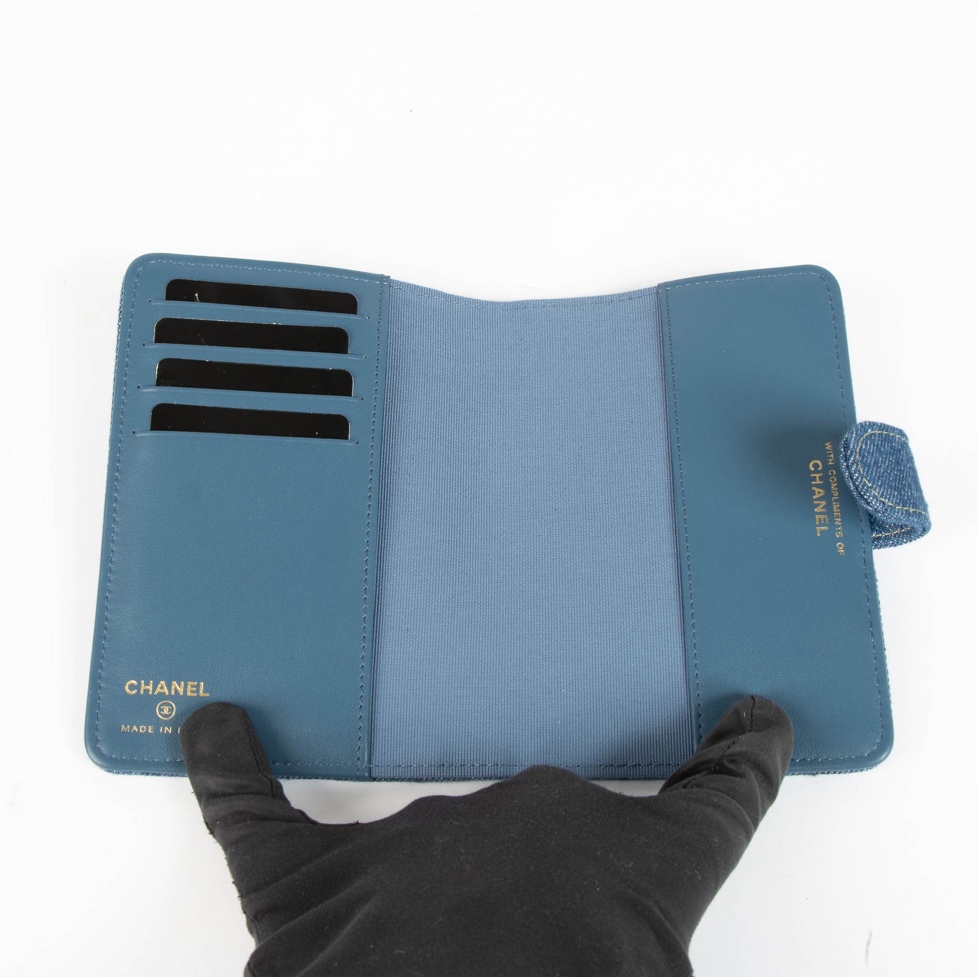 Shop this 100% authentic Chanel Blue Denim Passport Holder at Labellov.com