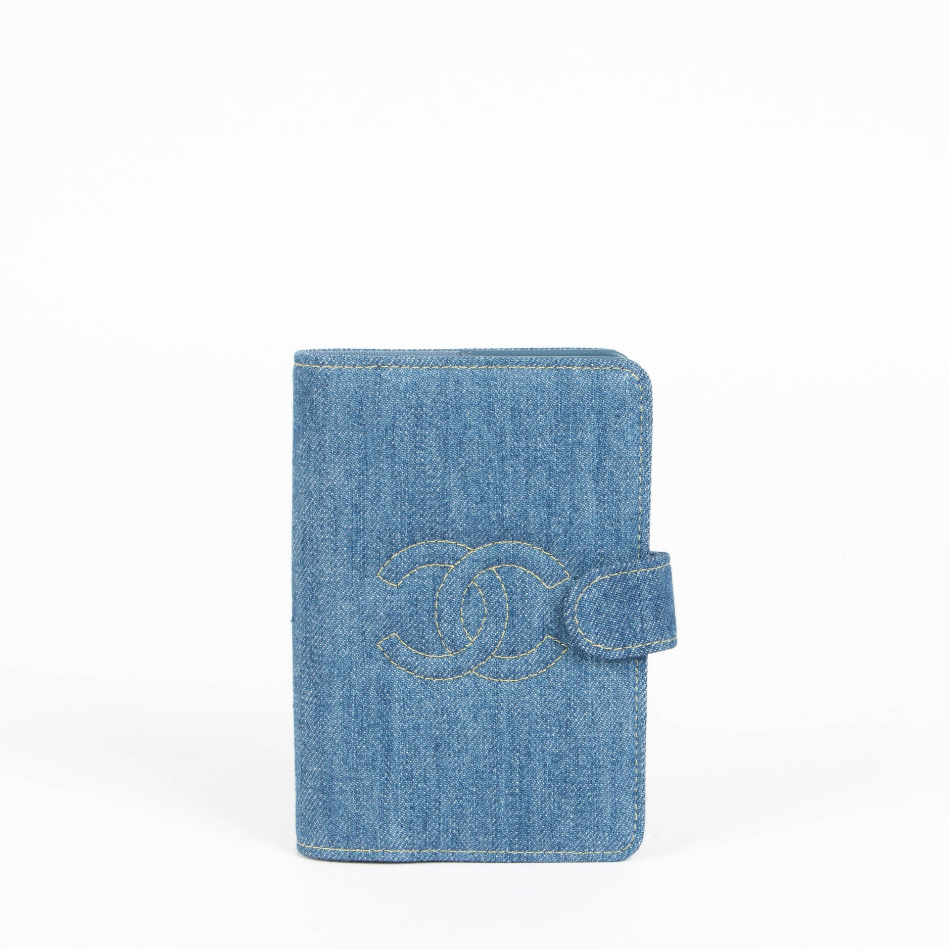 Shop this 100% authentic Chanel Blue Denim Passport Holder at Labellov.com