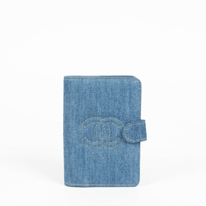 Shop this 100% authentic Chanel Blue Denim Passport Holder at Labellov.com