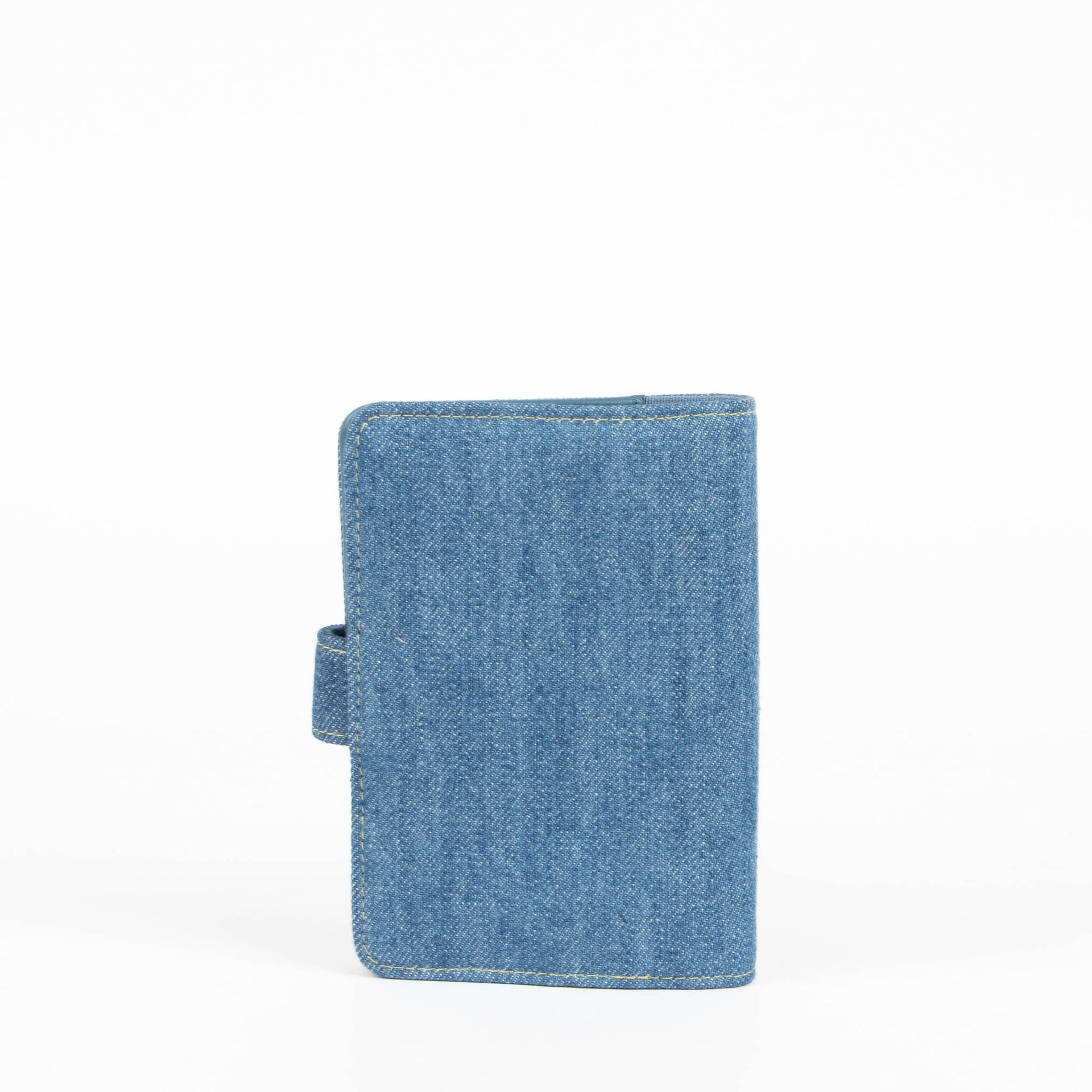 Shop this 100% authentic Chanel Blue Denim Passport Holder at Labellov.com