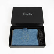 Shop this 100% authentic Chanel Blue Denim Passport Holder at Labellov.com