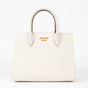 Shop this authentic Prada White/Pink Small Bibliothèque Tote pre-loved on Labellov.com 