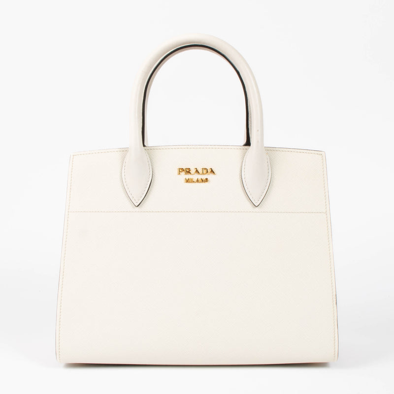 Shop this authentic Prada White/Pink Small Bibliothèque Tote pre-loved on Labellov.com 