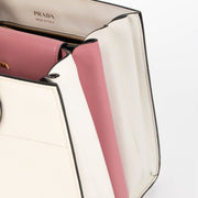 Shop this authentic Prada White/Pink Small Bibliothèque Tote pre-loved on Labellov.com 