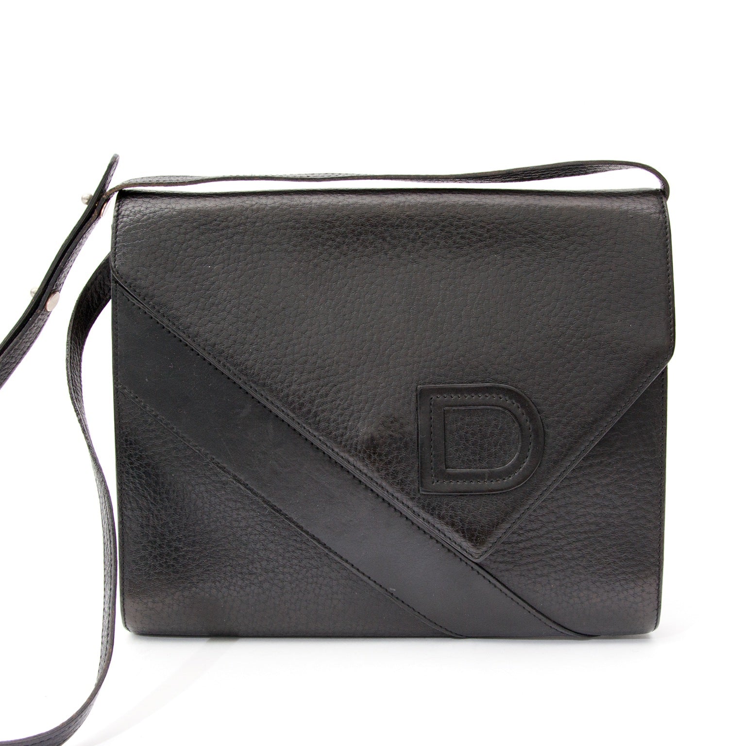 Delvaux Vintage Black Shoulder Bag With Unique V Shaped Flap Closure, For designer brands such as Louis Vuitton, Hermes, Chanel, Delvaux and many more, visit the online platform Labellov. The website offers a safe and secure platform to sell and buy new o