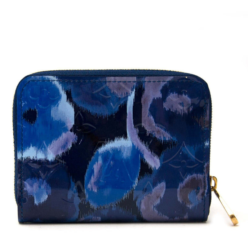 Second main Louis Vuitton Ikat portefeuille