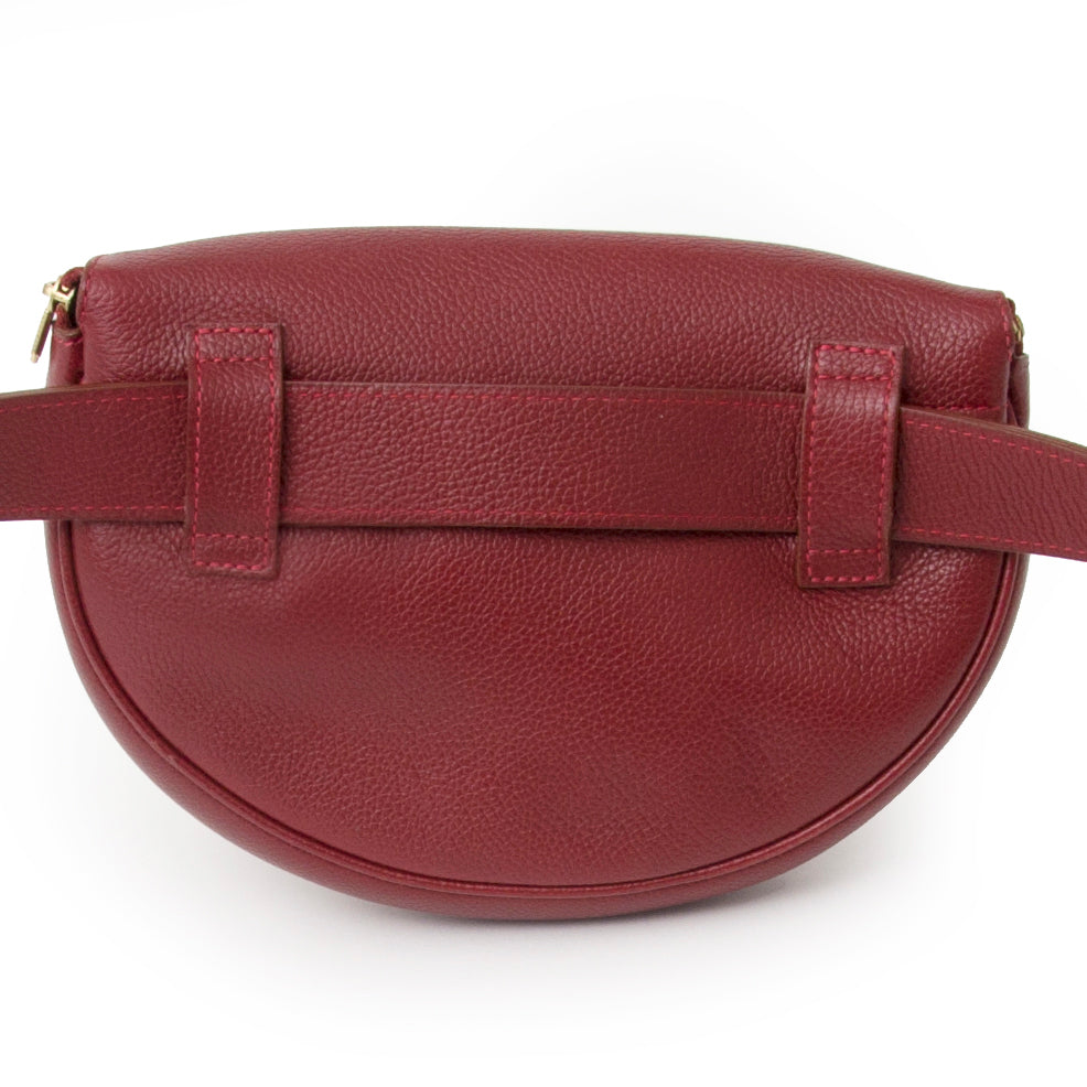 Delvaux Dark Red Belt Bag Sleek and minimal, this Delvaux bum bag or belt bag is made from grained calfskin in a dark red hue.