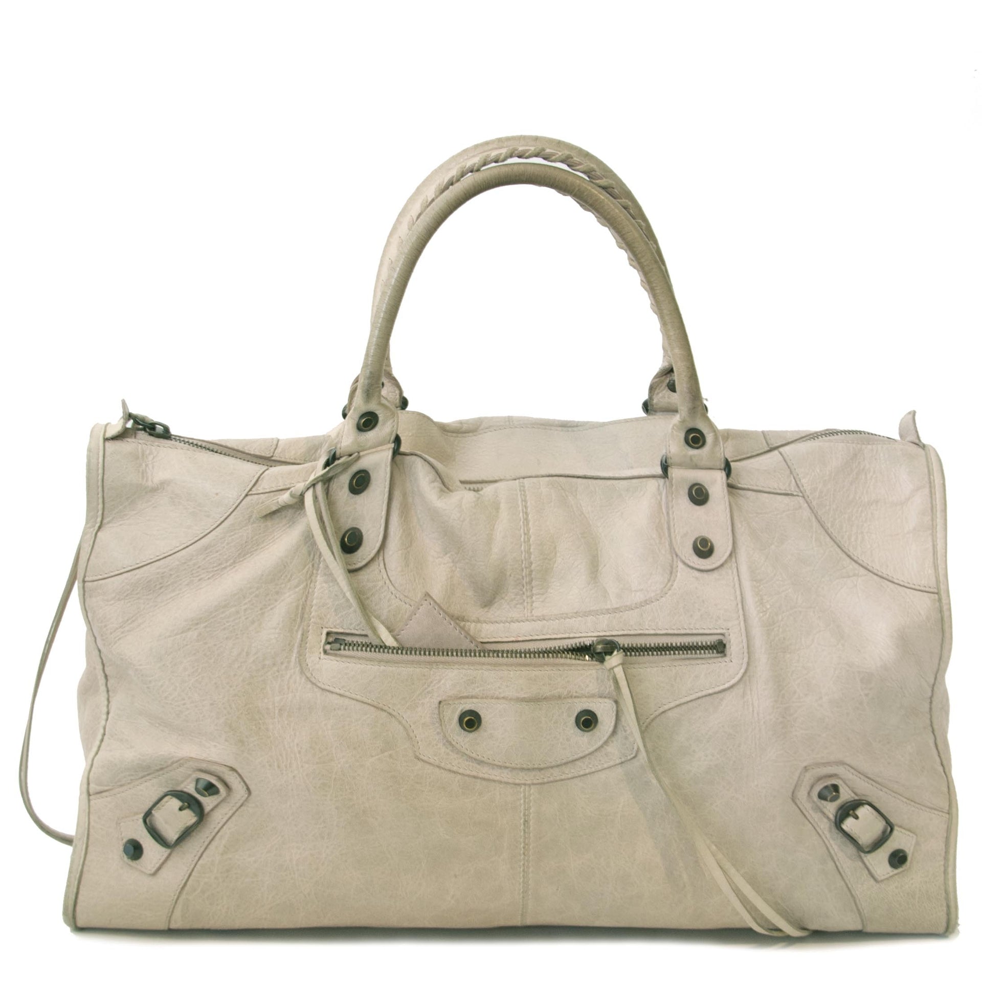shop safe online secondhand This oversized Balenciaga shoulder bag in Agneau leather fits the Utility trend perfectly! Its color is called Gris Poivre, a lovely neutral color that will work with just about anything in your wardrobe. The bag has large hard