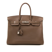 Op zoek naar het perfecte eindejaarsgeschenk? Koop uw Hermès Birkin 35 Etoupe Togo aan de beste prijs.