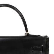 Look at this stunning hermes in black boxcalf leather with golden hardware.