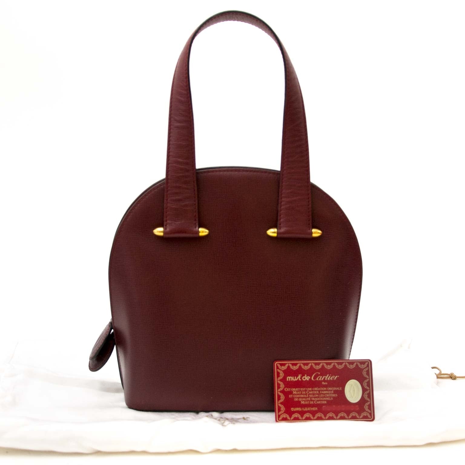 must de cartier bordeaux top handle bag now for sale at labellov vintage fashion webshop belgium