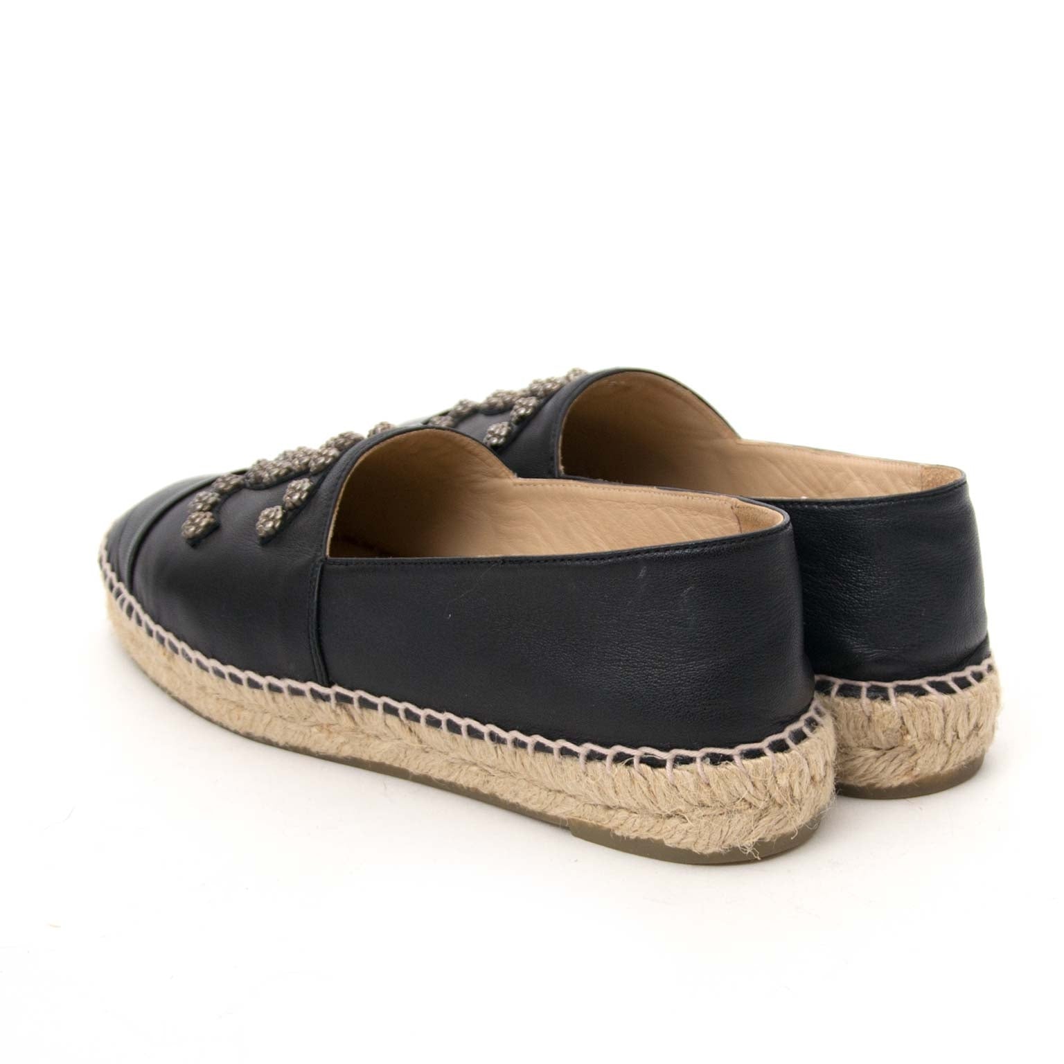 Buy secondhand authentic Chanel Black Lambskin Leather Camellia CC Stud Espadrilles for less at Labellov in Antwerp. Safe and secure shopping.