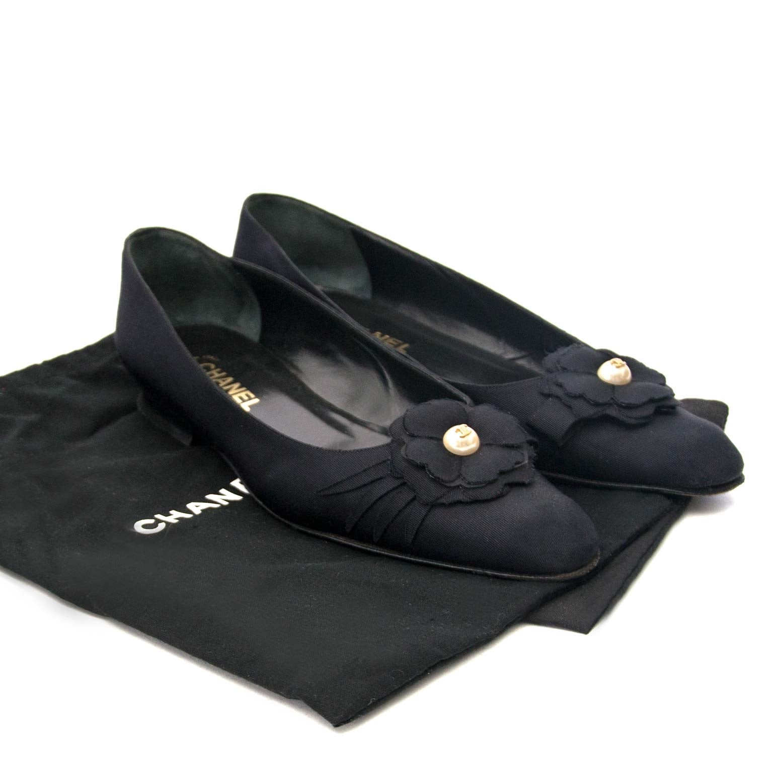 Are you looking for an authentic pair of Chanel Black Fabric Pearl Camelia Ballerina Flats?