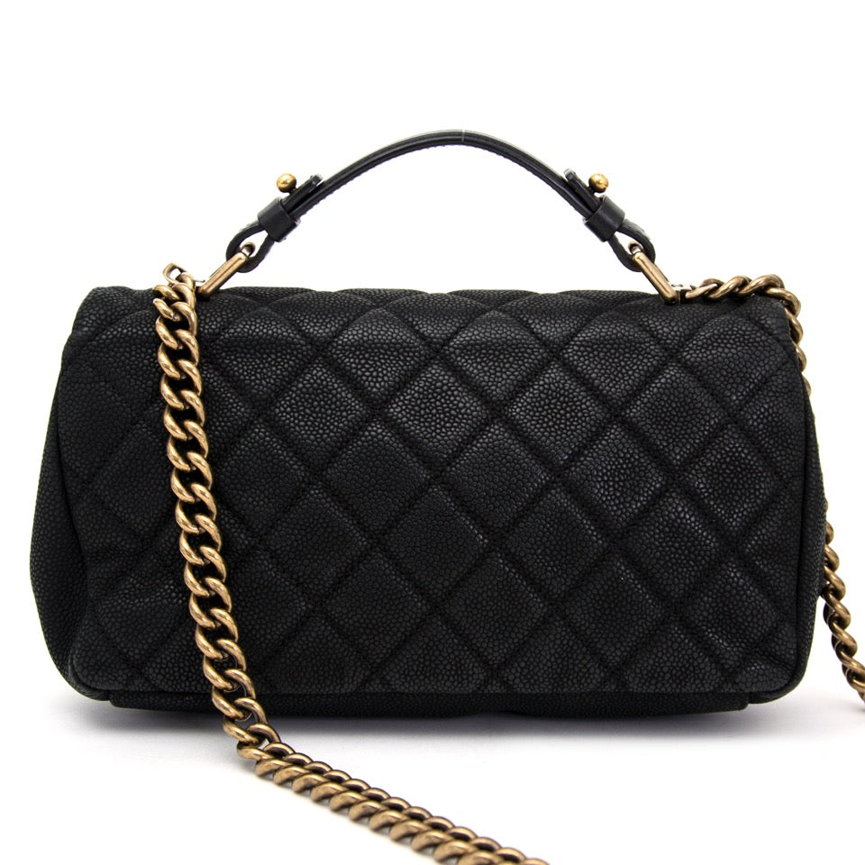 Buy Chanel Flap bag with top handle, online on Labellov. Safe and secure secondhand luxury.