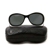 Are you interested in a pair of designer Chanel Oval Shaped Black Sunglasses?