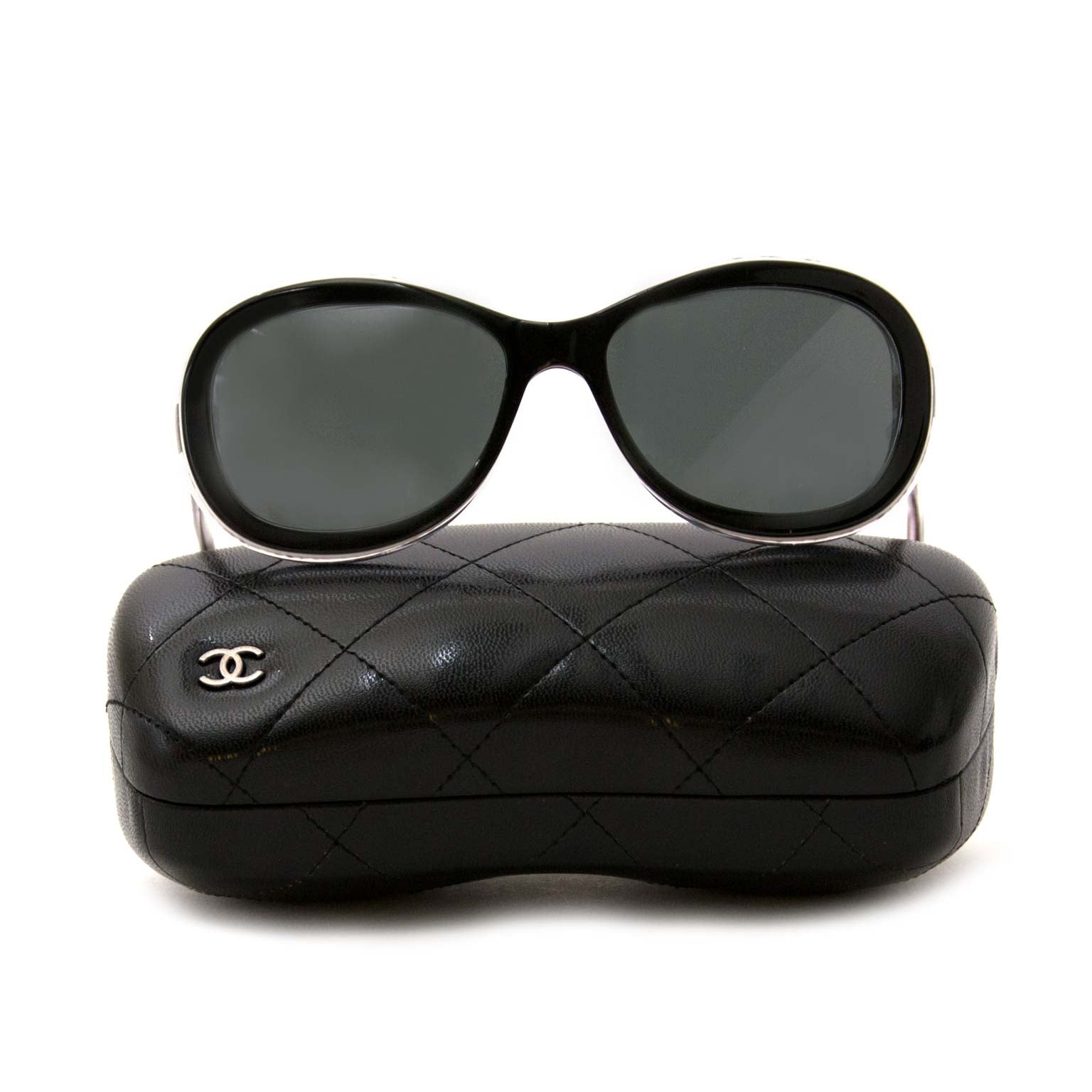 Are you interested in a pair of designer Chanel Oval Shaped Black Sunglasses?
