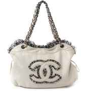 chanel tweed lambskin drawstring tweedy tote now for sale at labellov vintage fashion webshop belgium