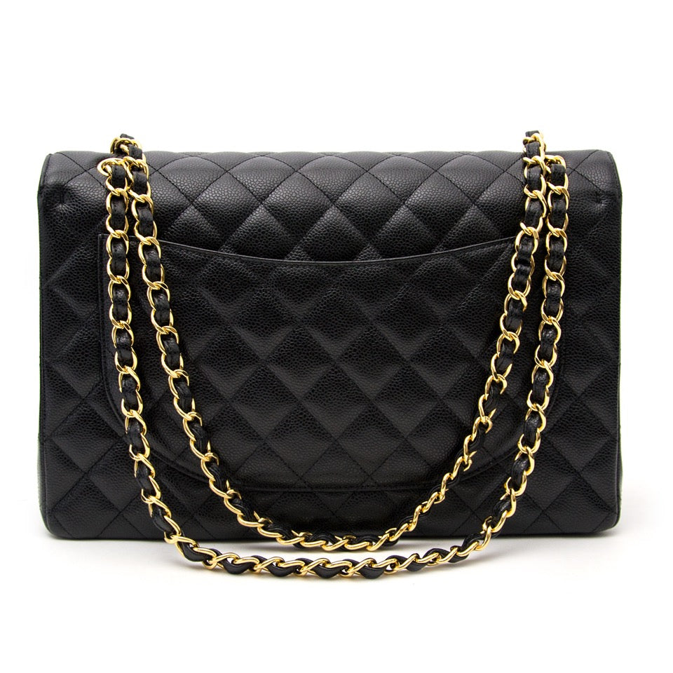 Buy the it bag Chanel Black Maxi Caviar Classic Double Flap Bag now on the website www.labellov.com or in the showroom in Antwerp, worldwide shipping from luxury goods.
