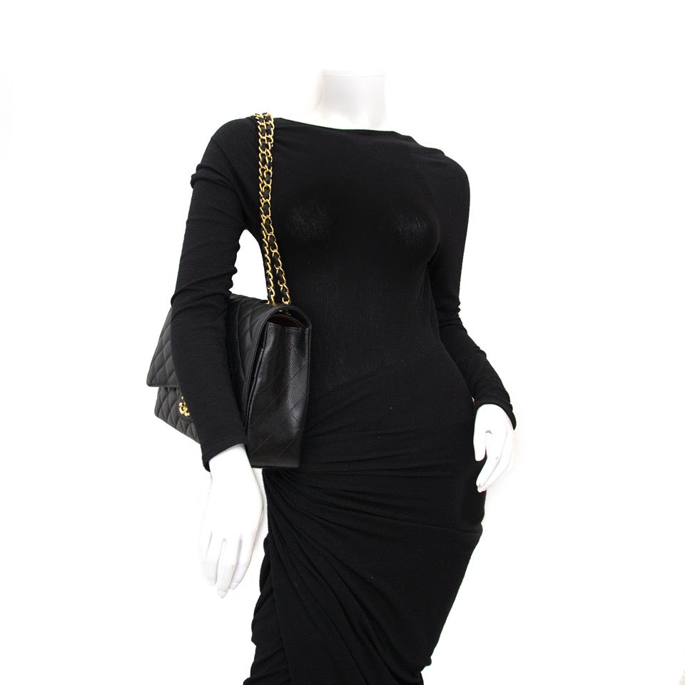 Luxury webshop www.labellov.com now offers a beautiful Chanel Black Maxi Caviar Classic Double Flap Bag, worldwide shipping and reasonable prices.