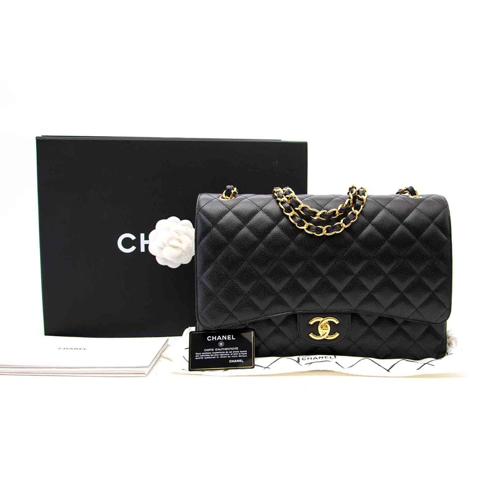 A Chanel Black Maxi Caviar Classic Double Flap Bag with dustbag, box, authenticity card is now for sale in Antwerp (Belgium) in LabelLOV, the luxury webshop and showroom for designer items.