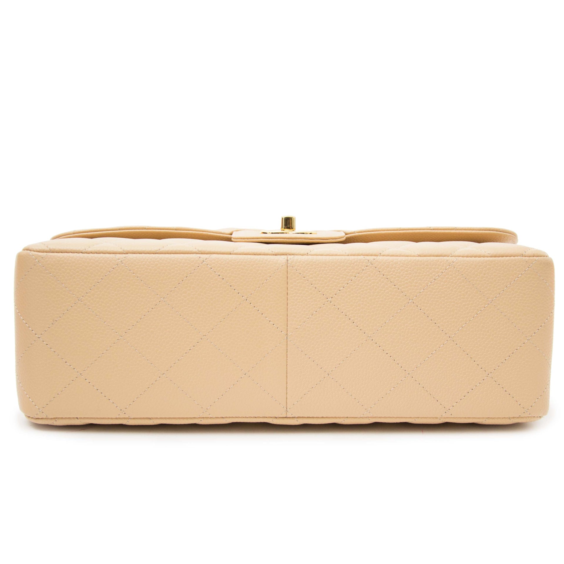 Skip the waiting list and get your Chanel Classic Flap Bag Jumbo Nude GHW at Labellov