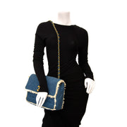 Buy yourself this Chanel 1990s Quilted Blue Denim Fringe Edge Flap Bag