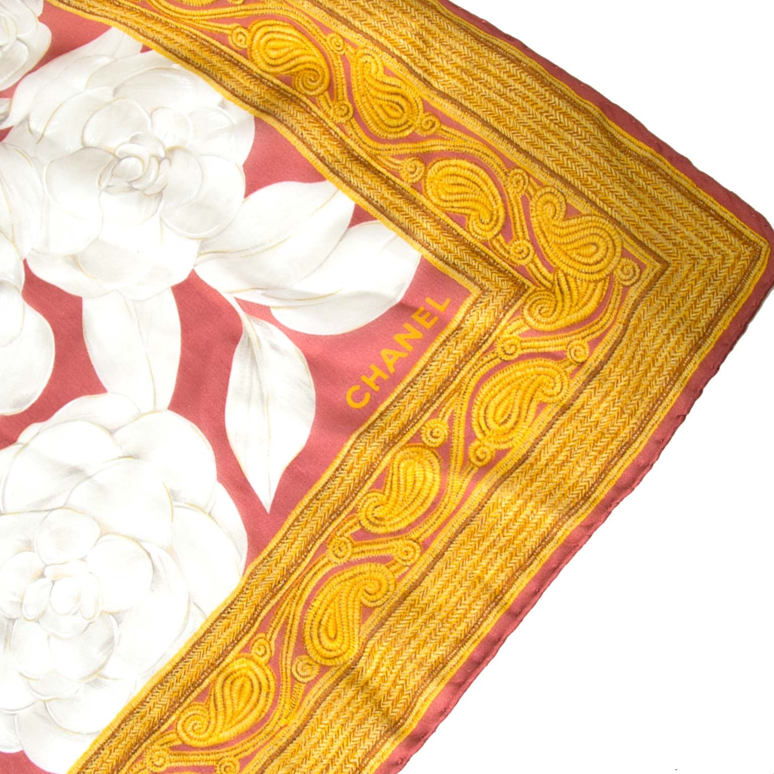 Chanel Rust & Gold Silk White Flower Scarf Buy authentic designer Chanel secondhand scarves at Labellov at the best price. Safe and secure shopping. Koop tweedehands authentieke Chanel sjaals bij designer webwinkel labellov.
