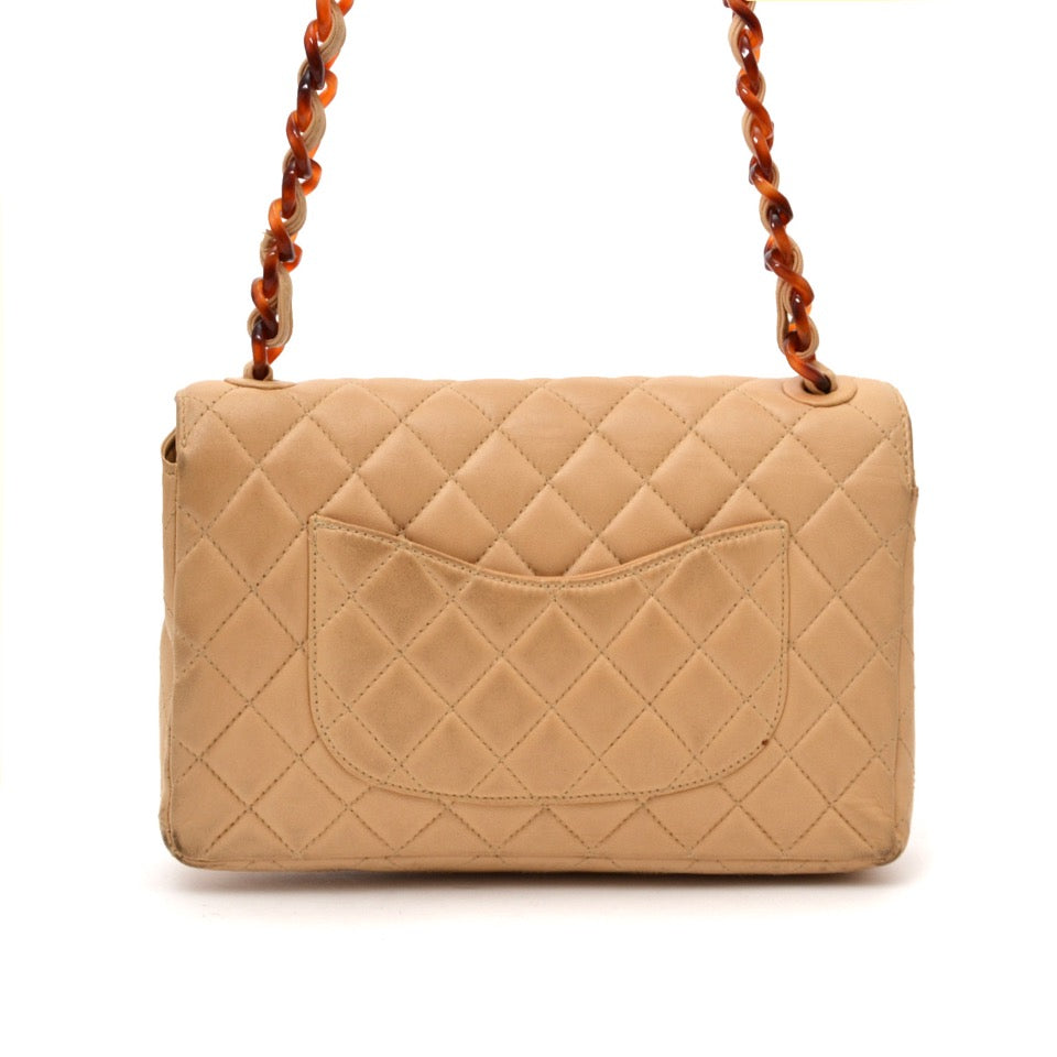 Looking for a designer bag? Buy your Chanel Classic Flap Bag Nude with Tortoise Details