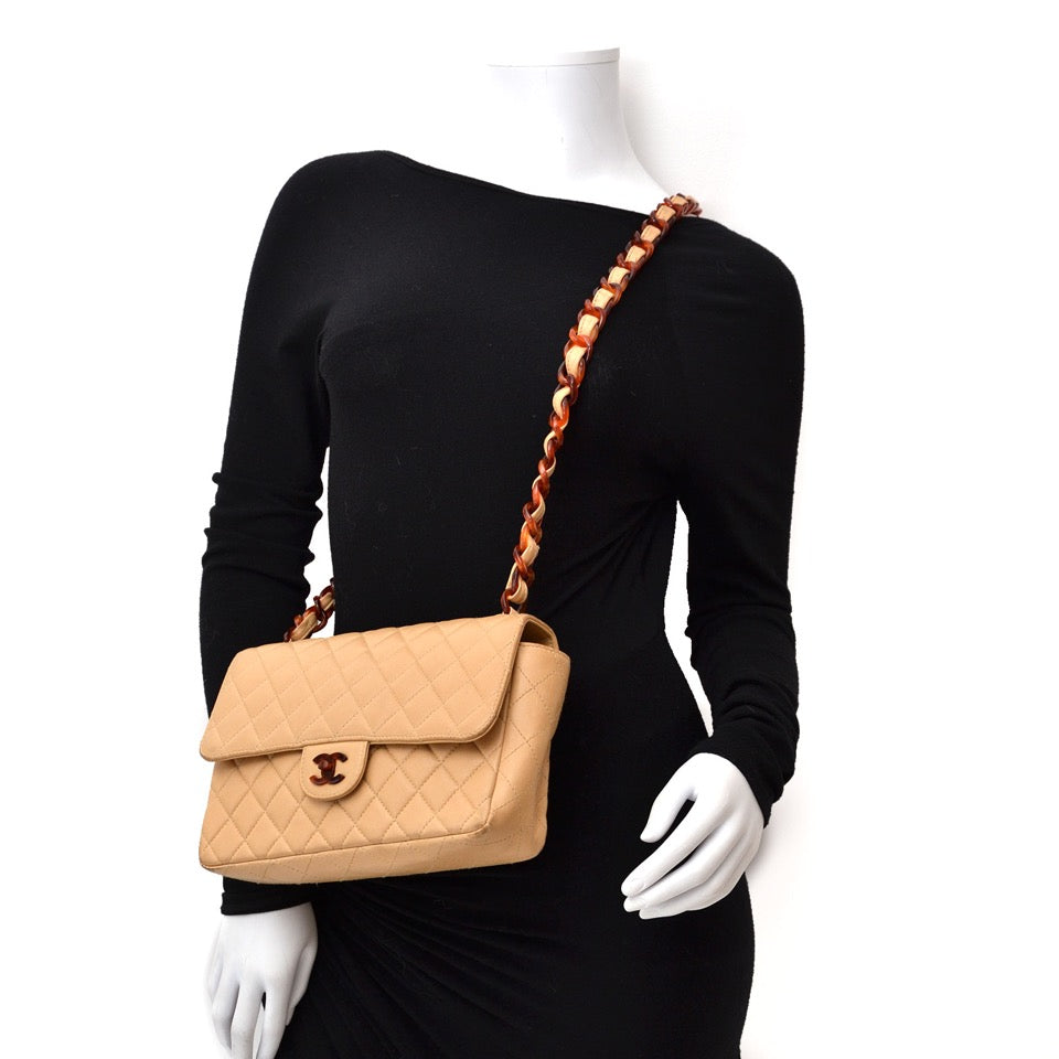 Buy your Chanel Classic Flap Bag Nude with Tortoise Details or sell your secondhand bags today!