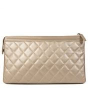 Authentieke tweedehands Chanel Boy Quilted Calfskin Gold Metallic Leather Clutch juiste prijs veilig online winkelen LabelLOV webshop luxe merken winkelen Antwerpen België mode fashion