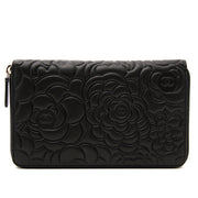 We buy and sell your timeless luxury bags and clutches such as this Chanel black leathet camelia clutch
