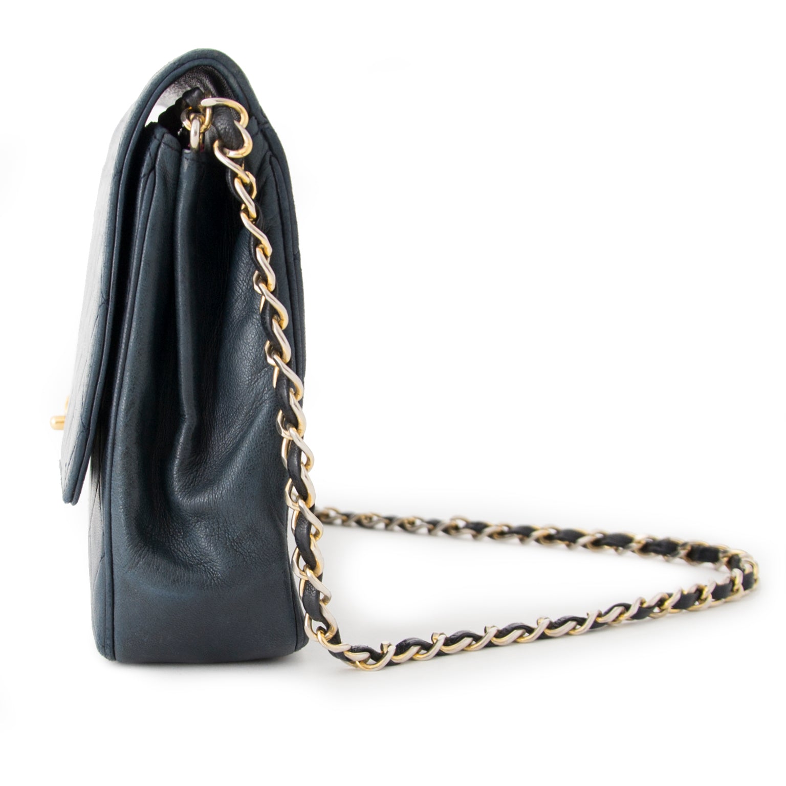 Buy authentic Chanel flap bag at the right price at LabelLOV vintage webshop. Luxe, vintage, fashion. Safe and secure online shopping. Antwerp, Belgium.