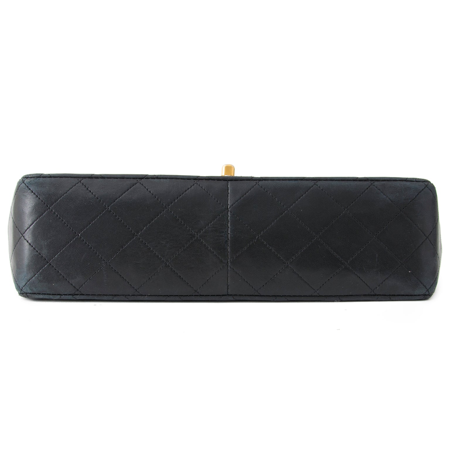 Buy authentic Chanel flap bag at the right price at LabelLOV vintage webshop. Luxe, vintage, fashion. Safe and secure online shopping. Antwerp, Belgium.
