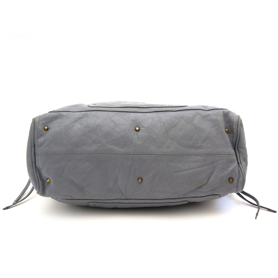 We buy and sell your designer handbags such as Chloé Babyblue Paddington Satchel Shoulder Bag